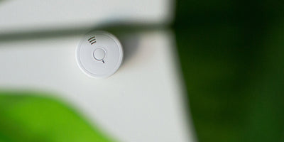 How often should you test and maintain smoke detectors?